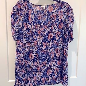 Floral Print, puffy shoulder, semi sheer, but can be worn without cami.